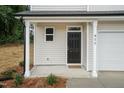 The front entrance features a dark-colored door and a covered porch with white columns at 411 N Mckay Ave, Dunn, NC 28334