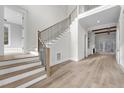 Bright and airy entryway with hardwood floors and staircase at 8417 Portmarnock Ct, Wake Forest, NC 27587