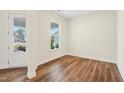 Bright room with wood flooring and exterior access at 2269 Abbeyhill Dr # 133, Raleigh, NC 27610