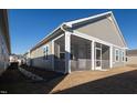 Gray house exterior with screened porch and landscaping at 108 Swain St, Clayton, NC 27527