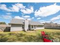 Large backyard with patio and plenty of space for outdoor activities at 60 Rock Harbor Ln, Spring Lake, NC 28390