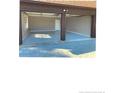 Two car garage with painted floor and extra storage at 15 Montana Ln, Spring Lake, NC 28390