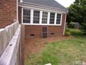 Brick house with sunroom and fenced yard at 1503 Fairview St, Dunn, NC 28334