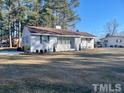 Ranch home with a large front yard at 1210 Guy Ave, Dunn, NC 28334