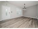 Bright dining room with gray walls and wood-look floors at 218 Mayors Ln, Wendell, NC 27591