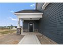 Front entry with stone columns and a dark-colored front door at 109 Hillwood Dr, Sanford, NC 27332