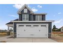 Two-story home with gray siding, white trim, and a two-car garage at 109 Hillwood Dr, Sanford, NC 27332