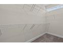 Large walk-in closet with wire shelving for ample storage at 58 Hillwood Dr, Sanford, NC 27332