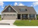 Two-story house with a two-car garage and stone accents at 58 Hillwood Dr, Sanford, NC 27332