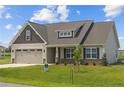 Two-story house with a two-car garage and stone accents at 58 Hillwood Dr, Sanford, NC 27332