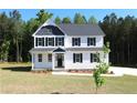 Two-story white house with black shutters at 117 Godwin Ct, Sanford, NC 27330