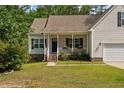 House exterior with a porch and well-maintained lawn at 240 Captain Hbr, Sanford, NC 27332