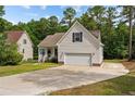 House exterior with a garage and a driveway at 240 Captain Hbr, Sanford, NC 27332