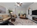 Spacious living room with comfy furniture and fireplace at 288 Gallery Dr # 204, Spring Lake, NC 28390