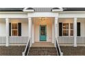 Craftsman style front door with a light teal color and black accents at 92 Woodbark Cv # 14, Willow Springs, NC 27592