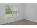 Bright bedroom with neutral walls and carpeting at 21 Falling Water Rd, Spring Lake, NC 28390