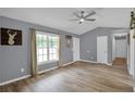 Spacious living room with vaulted ceiling and wood floors at 585 Bill Avery Rd, Coats, NC 27521