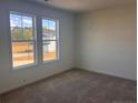 Bright bedroom featuring neutral walls and carpet flooring at 60 Marley (Lot 14) Way, Dunn, NC 28334