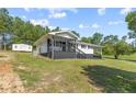 Newly renovated home with carport and porch at 2470 Wire Rd, Erwin, NC 28339