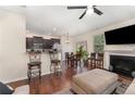 Kitchen with dark cabinets and a breakfast bar at 654 Stapleford Ln, Fuquay Varina, NC 27526