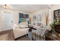 Living room with light-colored furniture and hardwood floors at 654 Stapleford Ln, Fuquay Varina, NC 27526