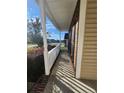 Side view of front porch with white railing at 420 Lenoir Dr. N Dr, Spring Lake, NC 28390