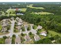 Aerial view of a neighborhood with houses and green spaces at 89 Jack Harris Ln, Spring Lake, NC 28390