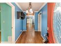 Bright entryway with hardwood floors and a view to the living room at 1634 Stonegate N, Sanford, NC 27332