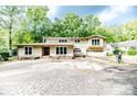 Two-story house with attached garage and landscaping at 1634 Stonegate N, Sanford, NC 27332