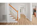 Bright, airy stairwell with light-colored wood railing at 150 Carrington Ave, Franklinton, NC 27525
