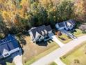 Aerial view of a charming house nestled in a wooded neighborhood at 150 Carrington Ave, Franklinton, NC 27525