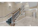 Grand staircase with ornate railing in condo building at 2810 Bedford Green Dr # 304, Raleigh, NC 27604