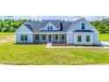 Modern farmhouse exterior with a gray facade and covered porch at Tbd 1 Cedar Lane Rd, Sanford, NC 27332