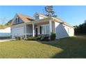 Two-story home with a two-car garage and well-maintained lawn at 4939 Pioneer Dr, Sanford, NC 27332