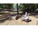 Relaxing backyard with fire pit and lake view at 5056 Bluebird Dr, Sanford, NC 27332