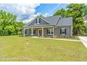 Gray farmhouse-style home with a front porch at Tbd 2 Cedar Lane Rd, Sanford, NC 27332