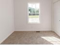 Simple bedroom with carpet and a window at 885 Loop Rd, Bunnlevel, NC 28323