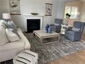 Spacious living room with fireplace and comfortable seating at 241 Bunting Dr, Lillington, NC 27546