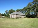Brick house with a large front yard and a two-car garage at 105 Water Fall Ln, Sanford, NC 27330