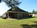 Brick house with a patio, outdoor kitchen, and expansive backyard at 105 Water Fall Ln, Sanford, NC 27330