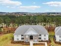 Apartment building showcasing a tree-lined landscape and distant hills at 260 Gallery Dr # 303, Spring Lake, NC 28390