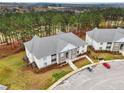 Apartment building with wooded backdrop and scenic views at 260 Gallery Dr # 303, Spring Lake, NC 28390