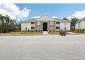 Two-story apartment building with parking and golf cart at 260 Gallery Dr # 303, Spring Lake, NC 28390