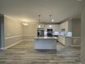 Modern kitchen with white cabinets, granite countertops, and an island at 240 Gallery Dr # 304, Spring Lake, NC 28390