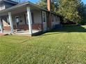 House with brick and siding, large front porch at 100 W C St, Erwin, NC 28339