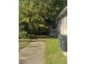 Side view of house with walkway and detached shed at 100 W C St, Erwin, NC 28339