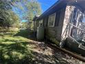 Side view of a small house with visible aging at 100 W C St, Erwin, NC 28339