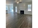 Spacious living room with a fireplace and hardwood floors at 174 Jones Creek Ln, Lillington, NC 27546