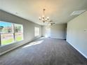 Spacious living room with large windows and neutral carpeting at 29 Red Bird Dr, Cameron, NC 28326