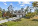 Two story house with a three car garage and manicured lawn at 20 Lakeforest Trl, Sanford, NC 27332